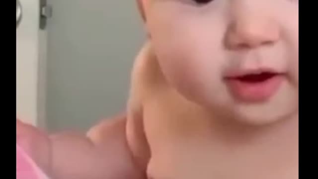 Baby is surprised to realize he is being filmed.