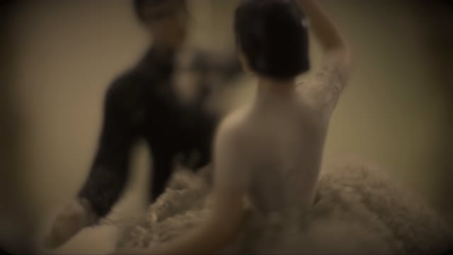 Image Of A Dancing Newlywed Couple Represented In A Music Box Toy