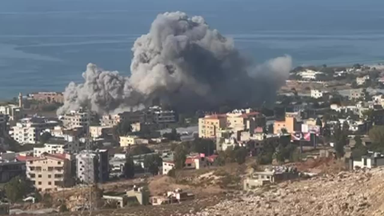 The village of Jiyeh in southern Lebanon under attack by Israeli fighter jets