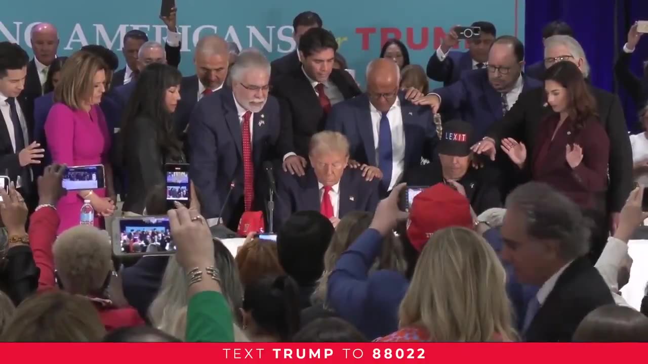 Latinos pray for President Donald Trump.