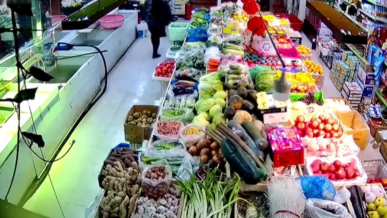 Astonishing moment 'cruel' supermarket owner kicks escaped fish back into tank