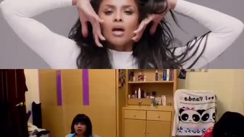 Blue shirt lady dances along to split screen of white music video