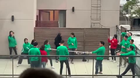 Squid Game fans play tug of war on New York rooftop