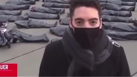 Reporter gives report in front of dead people but they start rising from the dead