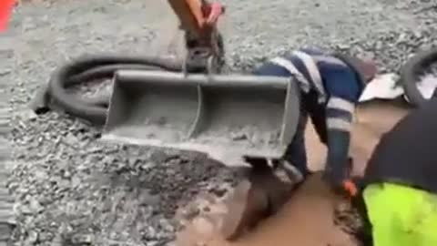 Excavator accidentally pushed man in a pit