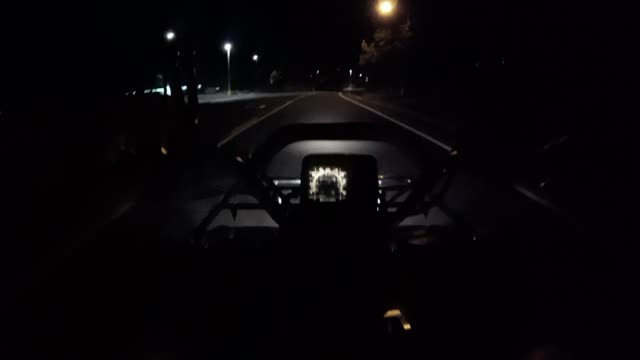 Cruising around the neighborhood in the dark with Suzuki King Quad