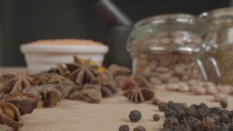 Extreme Close Up Tracking Out Shot of Spices and Grains on Table