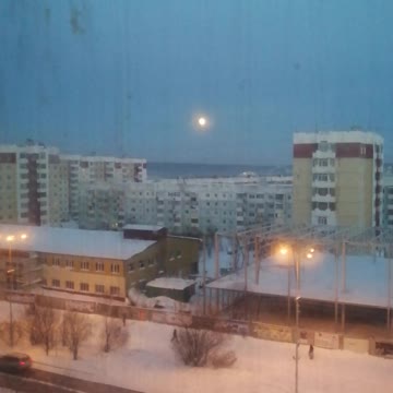 Beautiful moon over the city.