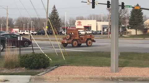 Car Made Completely of Wood Driving