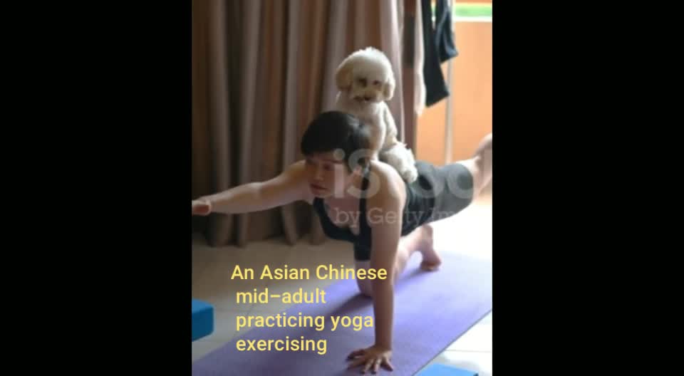 An Asian Chinese mid-adult practicing yoga exercising