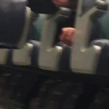 Drunk man sleeps on subway train rests head on arm rest