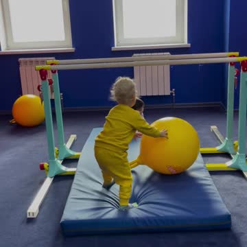 Kids are playing with colorful balls 🏀