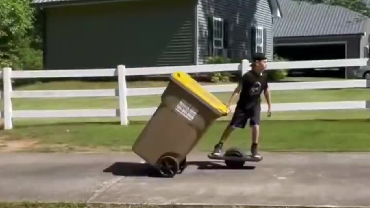 Boy uses electric skateboard to take out trash