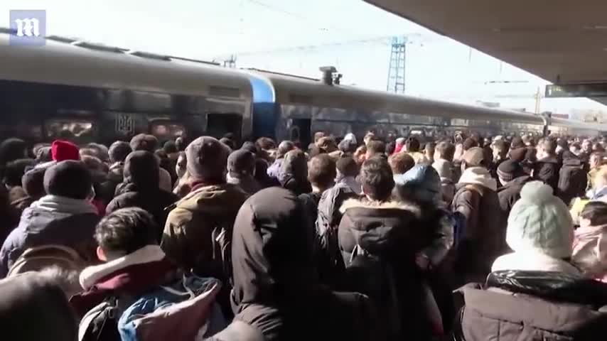 Ukraine: Terrifying Big moment soldier fires shots in the air to disperse crowds at a Kyiv station