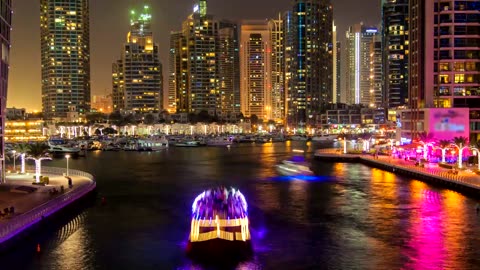 River of a city with boats at night