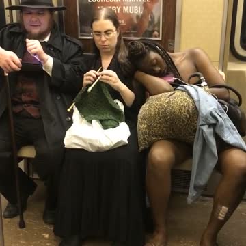 Amish guy woman sewing guy shirtles sleeping