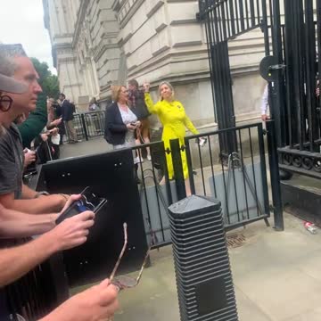British Cabinet Memeber Andrea Jenkyns gives commie protesters the middle finger