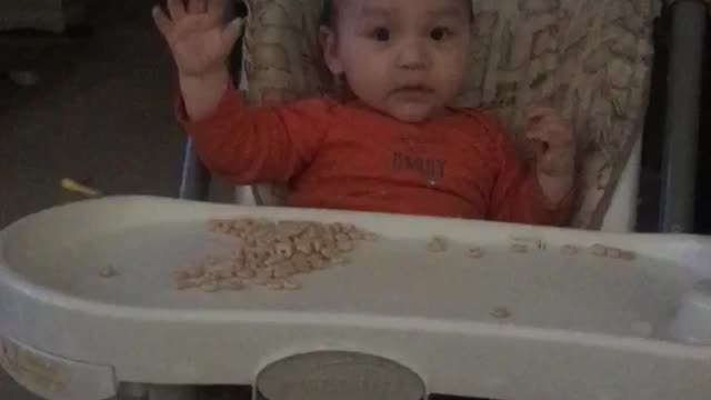 Baby learns to wave hello