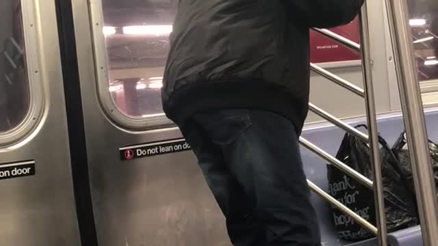 Man red shoes exercising legs on train