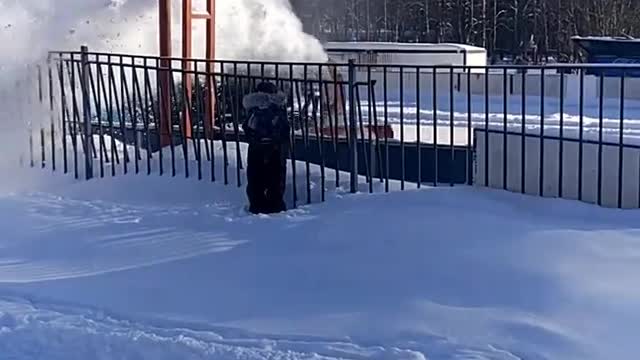 Kid Wants to Stand Under Snow Coming From Snow Blower