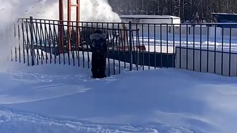 Kid Wants to Stand Under Snow Coming From Snow Blower