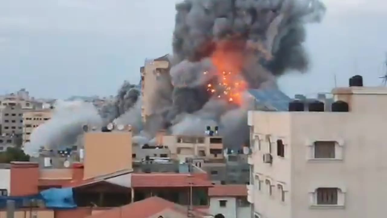 Israeli aircrafts destroy 14-story Palestine Tower in middle of Gaza Strip