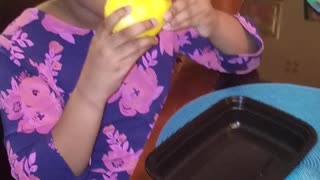 Leila eats her first mango!