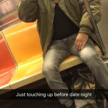 Man green bomber jacket shaving on subway