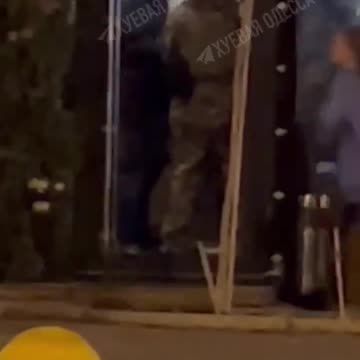 Ukrainian recruiters walks into a restaurant and approach civilian men