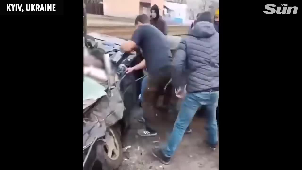 TANK crushes civilian car in Kyiv but driver is miraculously rescued alive