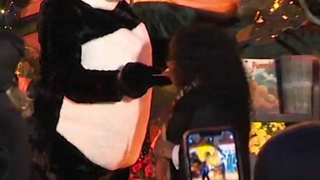 A SUPER excited Joe Biden & Jill Biden dressed as a Panda Bear hand out Halloween candy