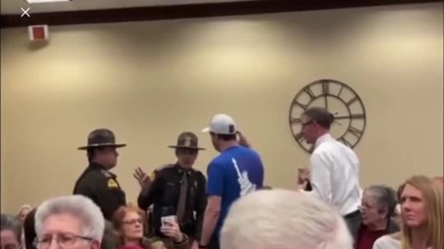 Salt Lake City arrested a man for wearing a patriotic shirt at a school board meeting.