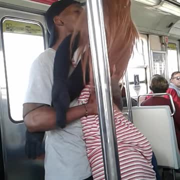 Guy black snapback hat dancing with red striped shirt doll subway