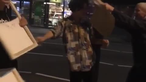 Two friends hit each other with canvas