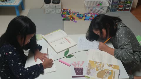 Video of young students writing their book after reading a book