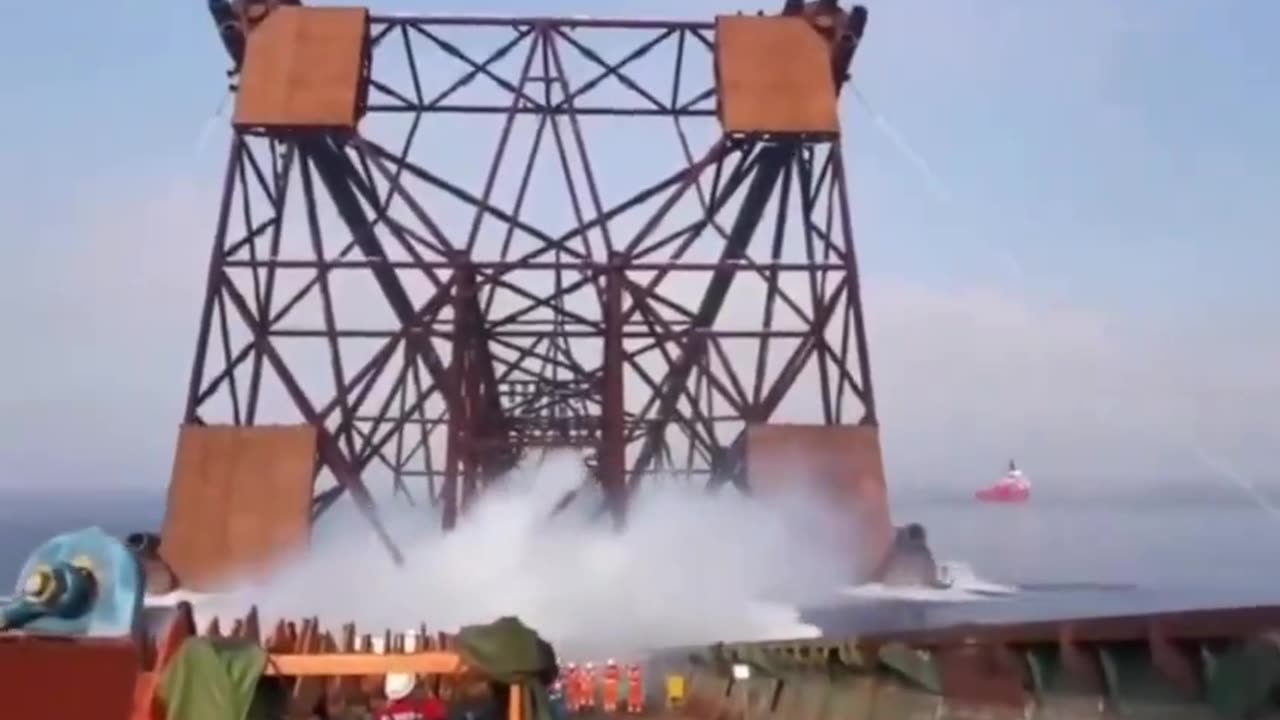 An oil rig being deployed offshore