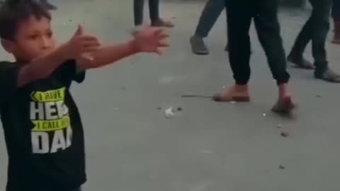 A boy is distributing water Bangladesh student protests 2024