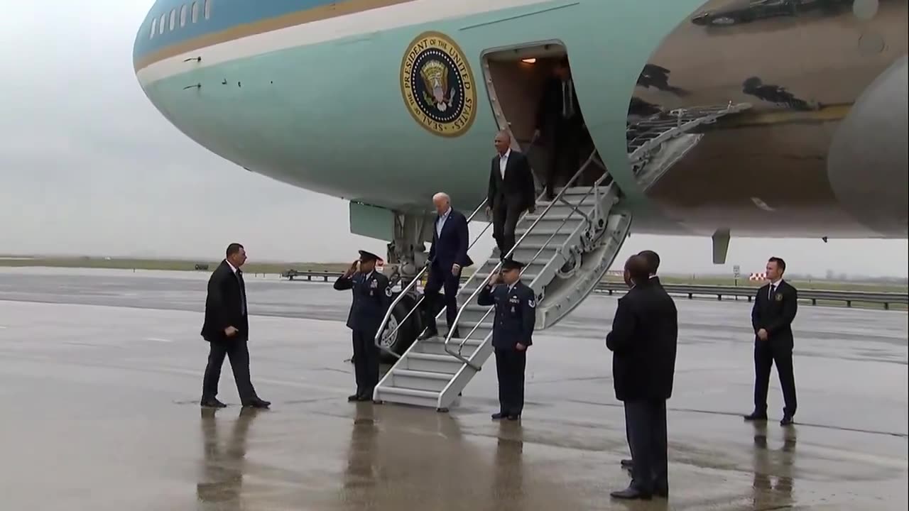 HUMILIATING: Obama follows Biden down the short stairs after landing in New