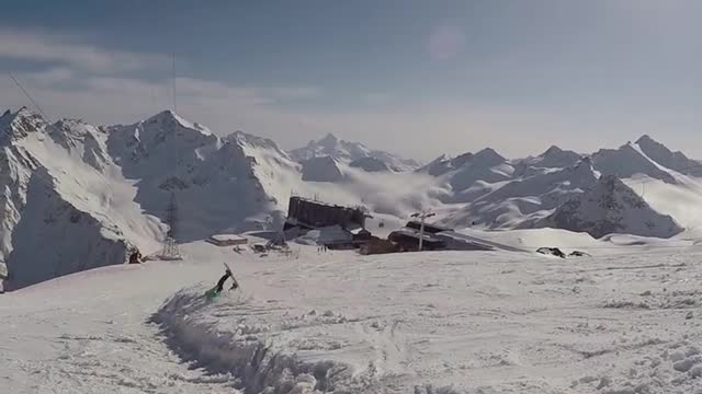 Man Rolls Down Snow After Attempting To Jump With The Snowboard