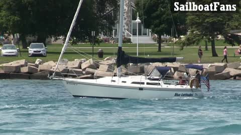 Blue Latitudes Sailboat Cruising Down St Clair River In Great Lakes