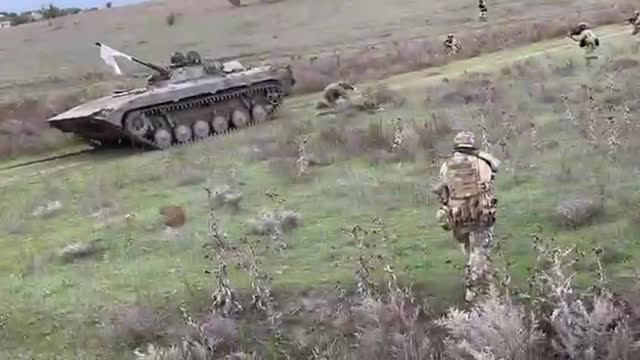 Russian troops in a BMP2 surrender