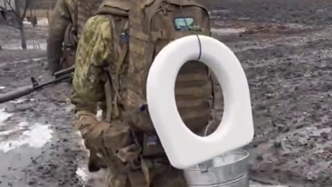 Ukrainian soldiers retreating from Bakhmut, with toilet seat