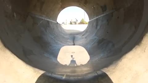 Guy Performs Amazing 360-degree Spin Inside a Big Tunnel While Skateboarding