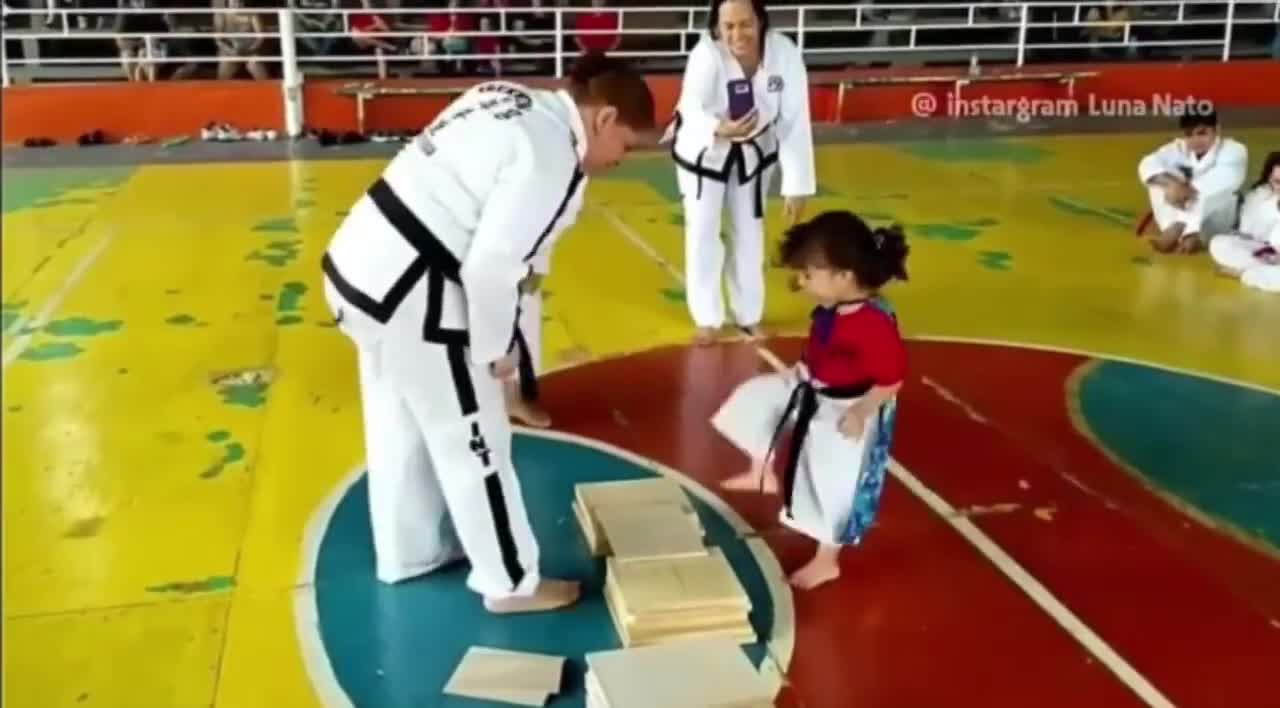 Little martial arts girl tries to break wood board.. 😂