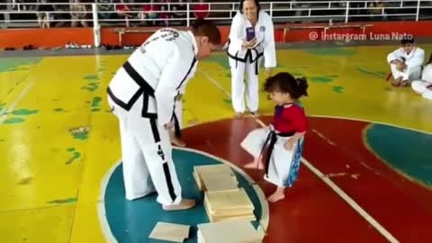 Little martial arts girl tries to break wood board.. 😂