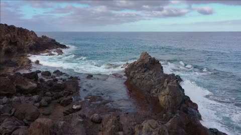 flying over the rocky coast of tenerife and the atlantic ocean canary islands spain