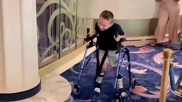 Boy With Cerebral Palsy Heroically Walks To Mickey Mouse