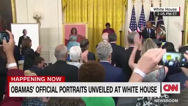 Barack Obama gives a speech after the unveiling of his White House portrait