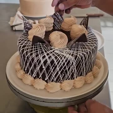 "ChocArt Elegance: Masterful Chocolate Cake Decorations That Taste as Divine as They Look!"