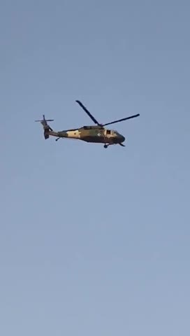 Taliban flying Blackhawk Helicopter over Kandahar